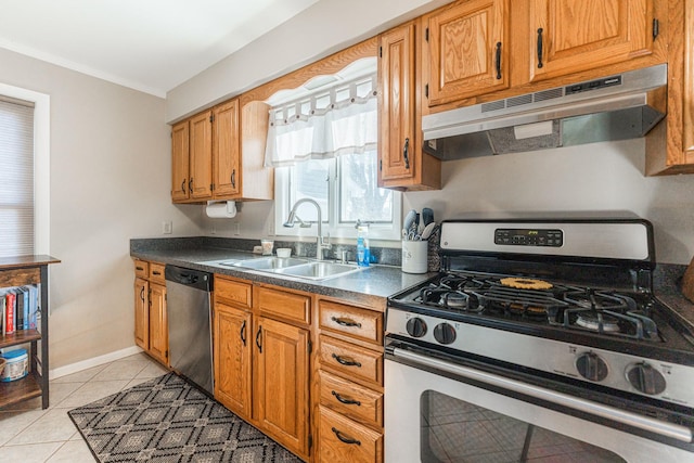 kitchen featuring sink, light tile patterned flooring, and appliances with stainless steel finishes