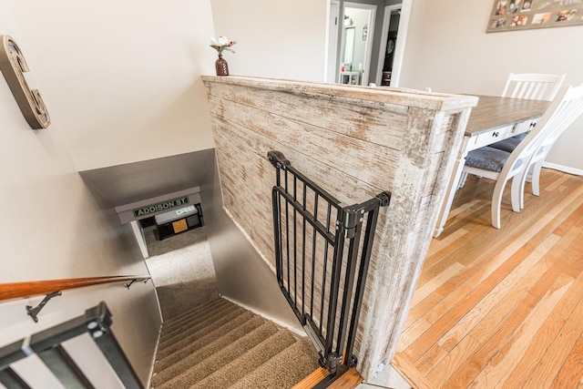 stairs with wood-type flooring