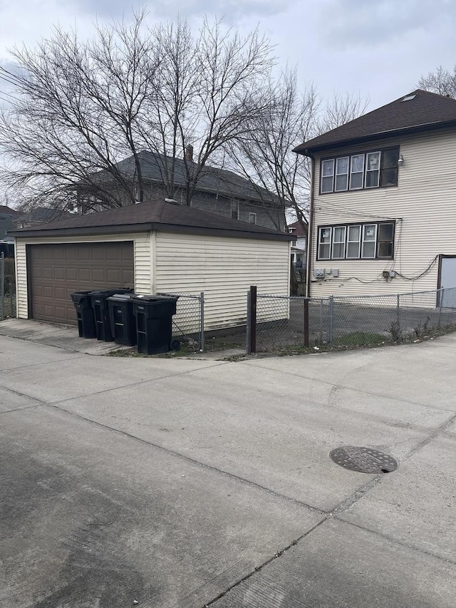 view of side of property featuring a garage and an outdoor structure