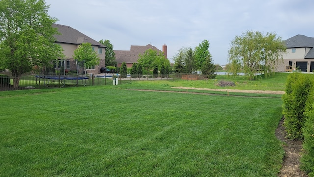 view of yard with a trampoline