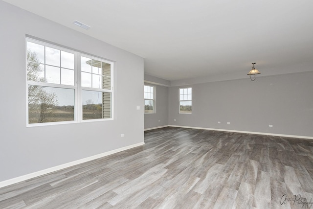 unfurnished room featuring wood-type flooring