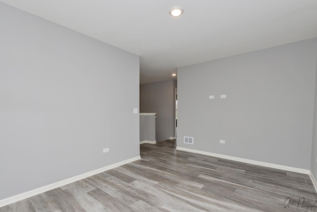 unfurnished room featuring hardwood / wood-style floors