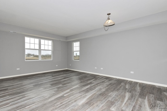 empty room featuring hardwood / wood-style flooring