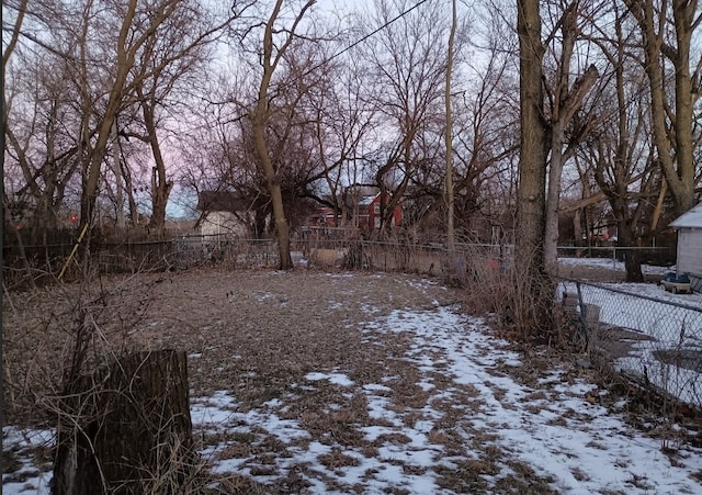 view of yard layered in snow