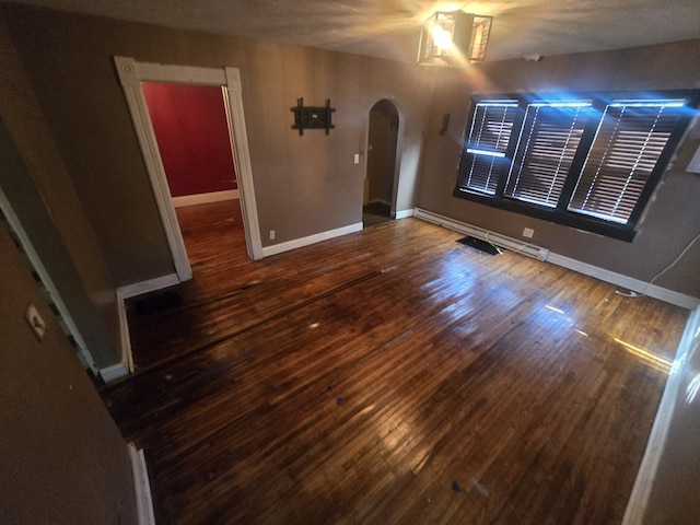 unfurnished room featuring dark hardwood / wood-style floors