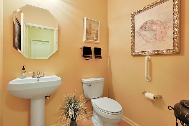 bathroom featuring sink and toilet