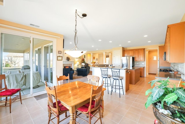 dining area with light tile patterned floors