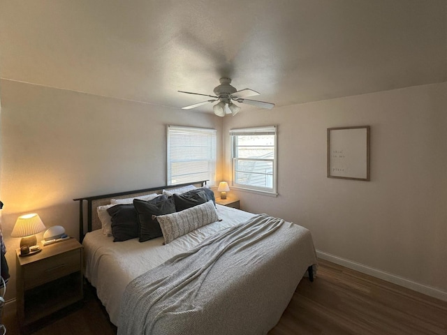bedroom featuring dark wood-type flooring and ceiling fan