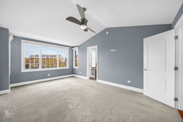 unfurnished bedroom featuring lofted ceiling, carpet flooring, and ceiling fan