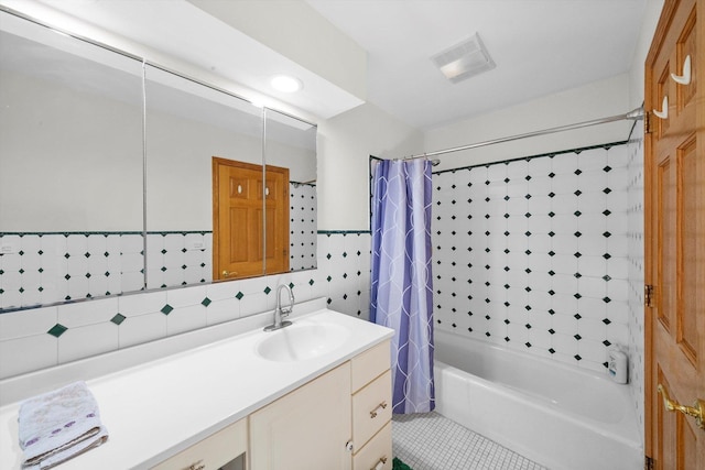 bathroom featuring vanity, tile patterned floors, shower / tub combo with curtain, and backsplash