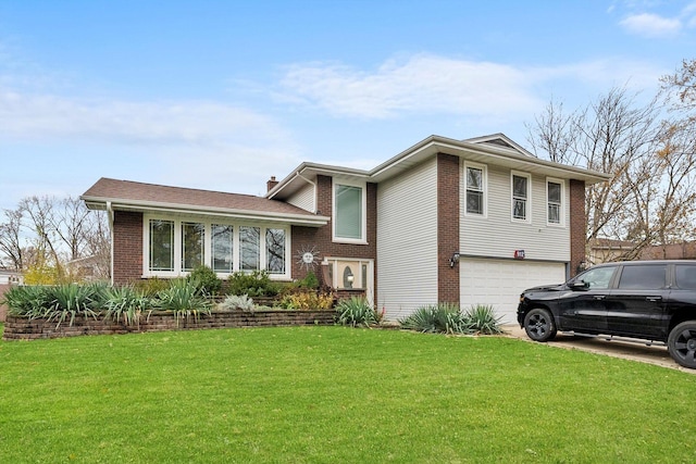 split level home with a garage and a front lawn