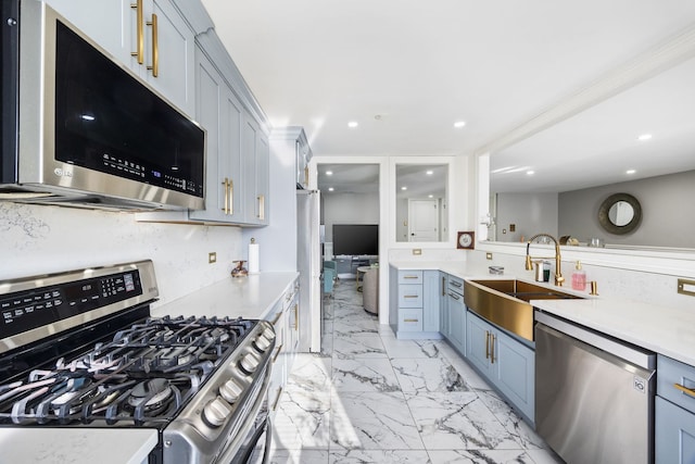 kitchen featuring sink, backsplash, and appliances with stainless steel finishes