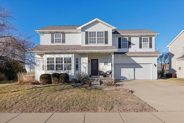 view of property with a garage, a porch, and a front yard