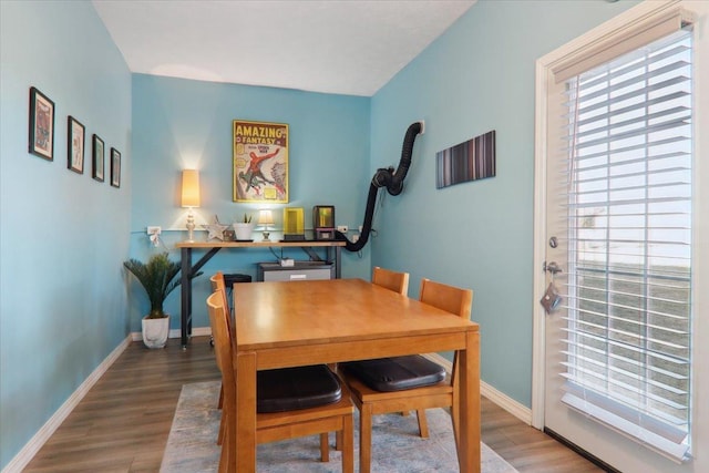 dining area with hardwood / wood-style floors