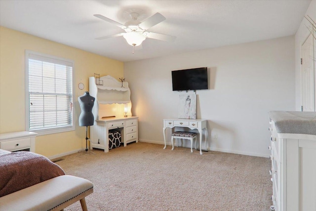 bedroom with ceiling fan and light carpet