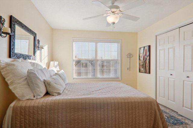 bedroom with ceiling fan and a closet