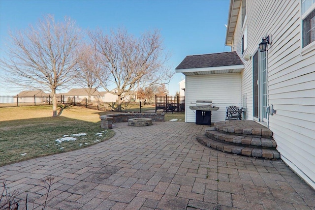 view of patio featuring a grill and a fire pit