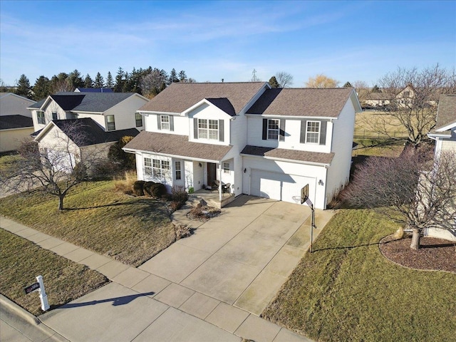 view of front facade with a garage and a front yard