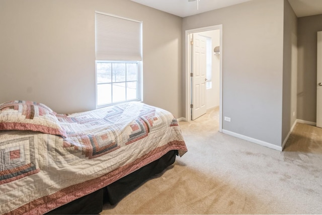 bedroom featuring light colored carpet