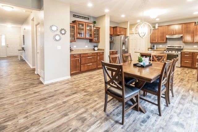 dining area featuring light wood-type flooring