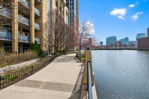 view of home's community with a water view