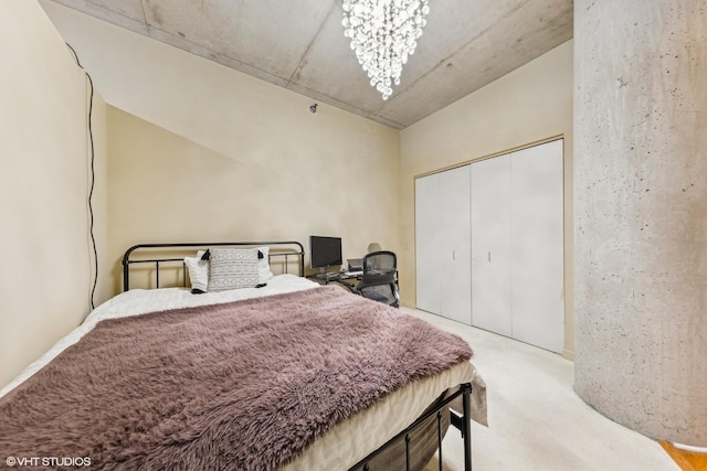 carpeted bedroom with a chandelier and a closet