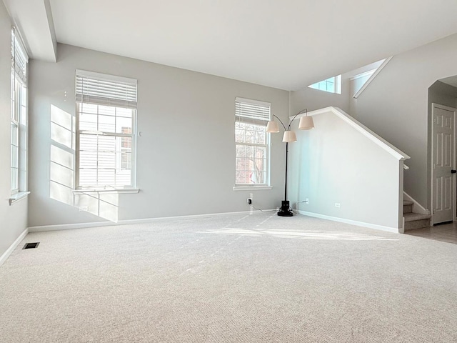 unfurnished living room featuring carpet