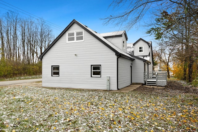 view of property exterior featuring a deck