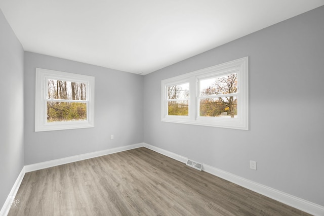 unfurnished room featuring light hardwood / wood-style flooring