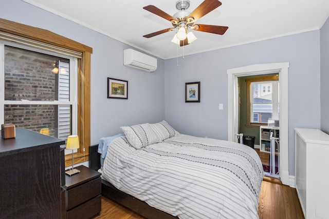 bedroom with crown molding, dark wood-type flooring, a wall mounted air conditioner, and ceiling fan