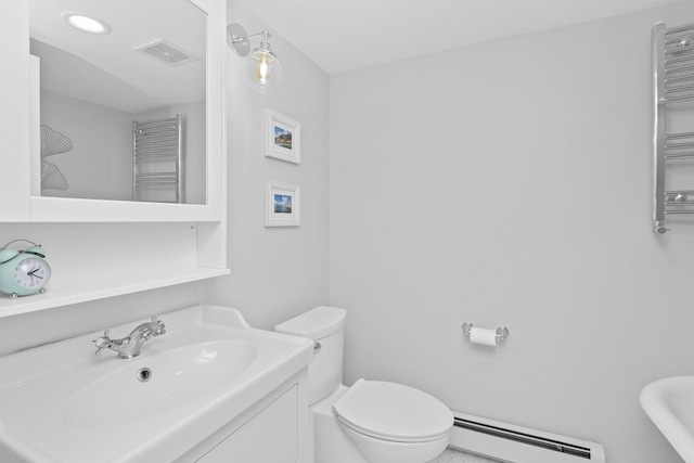 bathroom with vanity, a baseboard radiator, and toilet