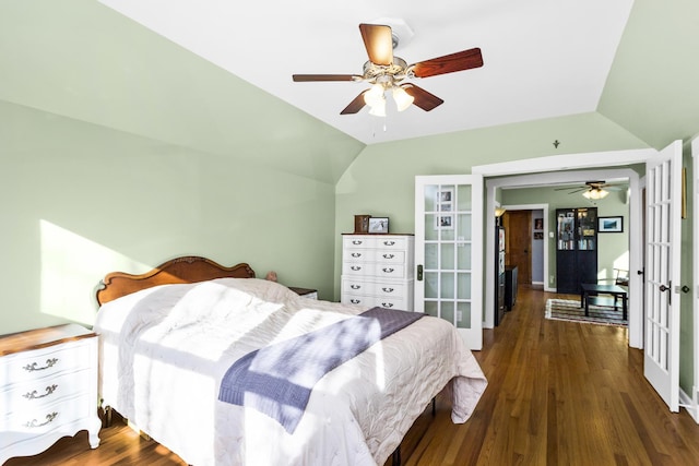 bedroom featuring lofted ceiling, dark wood-type flooring, ceiling fan, and french doors