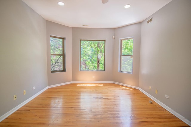 unfurnished room with light hardwood / wood-style flooring