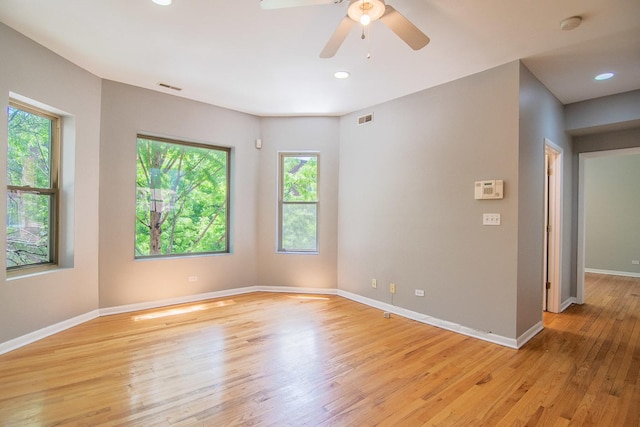 empty room with light hardwood / wood-style floors and ceiling fan