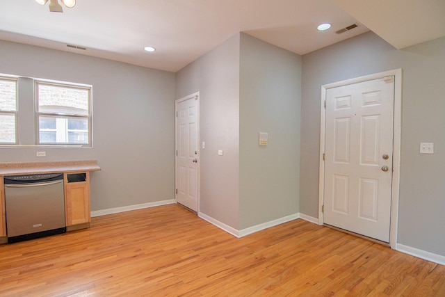 interior space featuring dishwasher and light hardwood / wood-style flooring