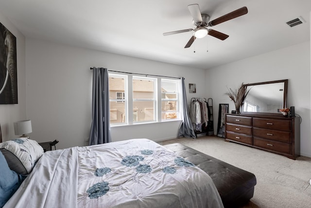 bedroom with light carpet and ceiling fan