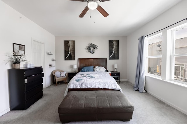 bedroom with ceiling fan and light colored carpet