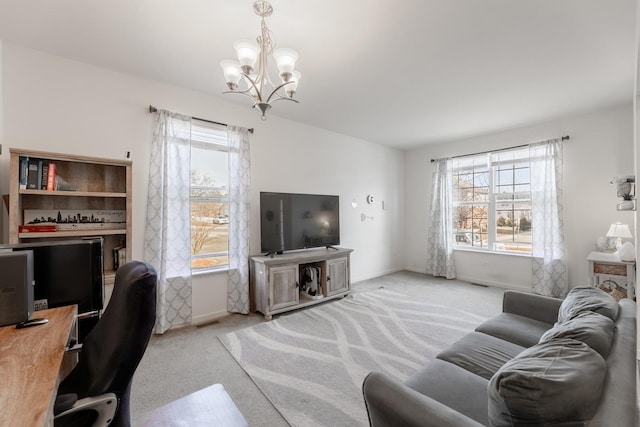 living room with an inviting chandelier, light carpet, and a wealth of natural light