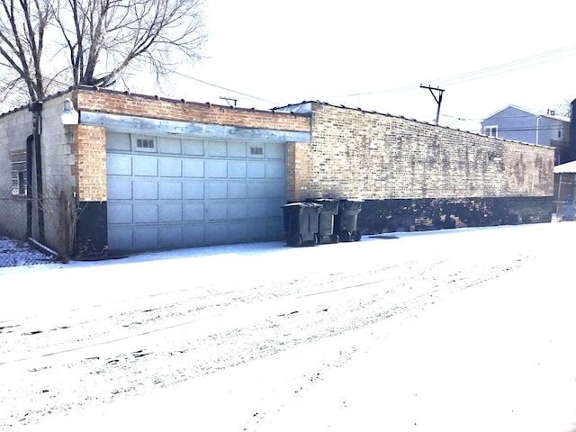 view of snow covered garage