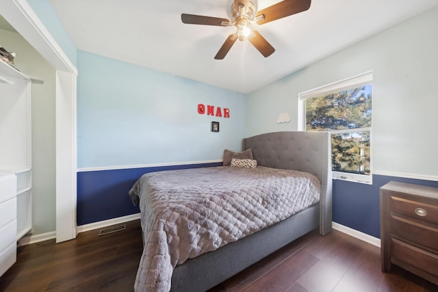 bedroom featuring dark hardwood / wood-style floors and ceiling fan