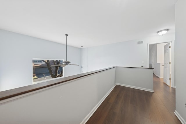 hallway featuring dark hardwood / wood-style flooring