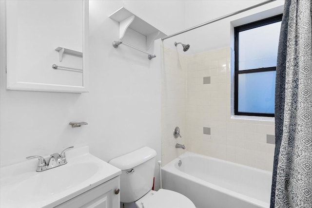 full bathroom featuring vanity, toilet, and shower / tub combo with curtain