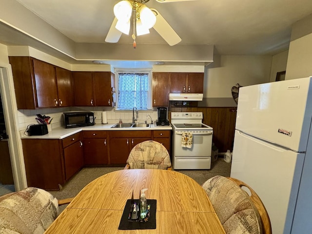 kitchen featuring sink, white appliances, ceiling fan, and backsplash