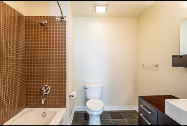 full bathroom featuring vanity, tile patterned flooring, tiled shower / bath combo, and toilet