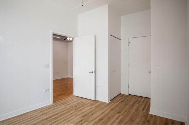 unfurnished bedroom featuring light wood-type flooring