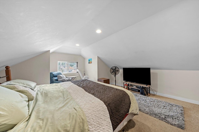 carpeted bedroom featuring lofted ceiling