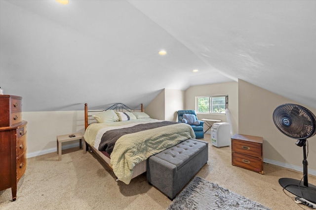 carpeted bedroom with vaulted ceiling