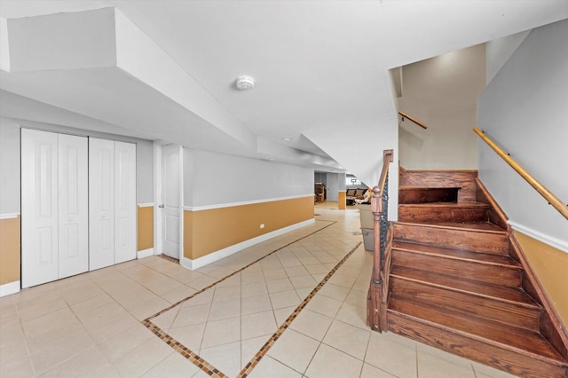 stairs featuring tile patterned flooring