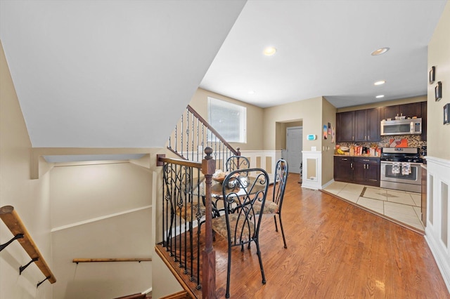 stairway with wood-type flooring