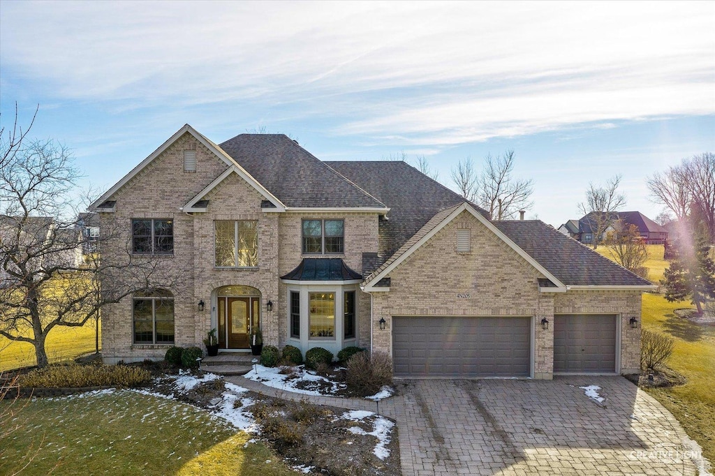 view of front of property with a garage